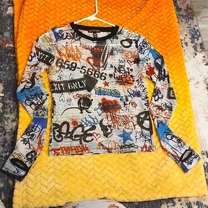 Sheer long-sleeve graffiti design top.